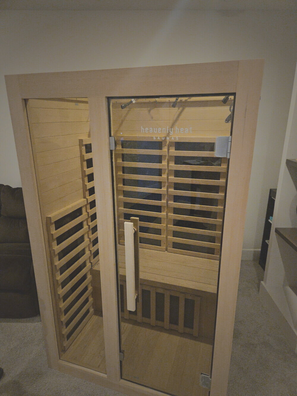 An infrared sauna uncrated, assembled, and installed in a client's room