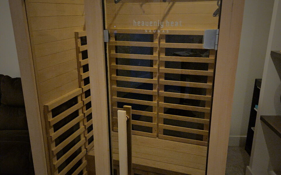 An infrared sauna delivered, uncrated and assembled, standing finished in the client's room.